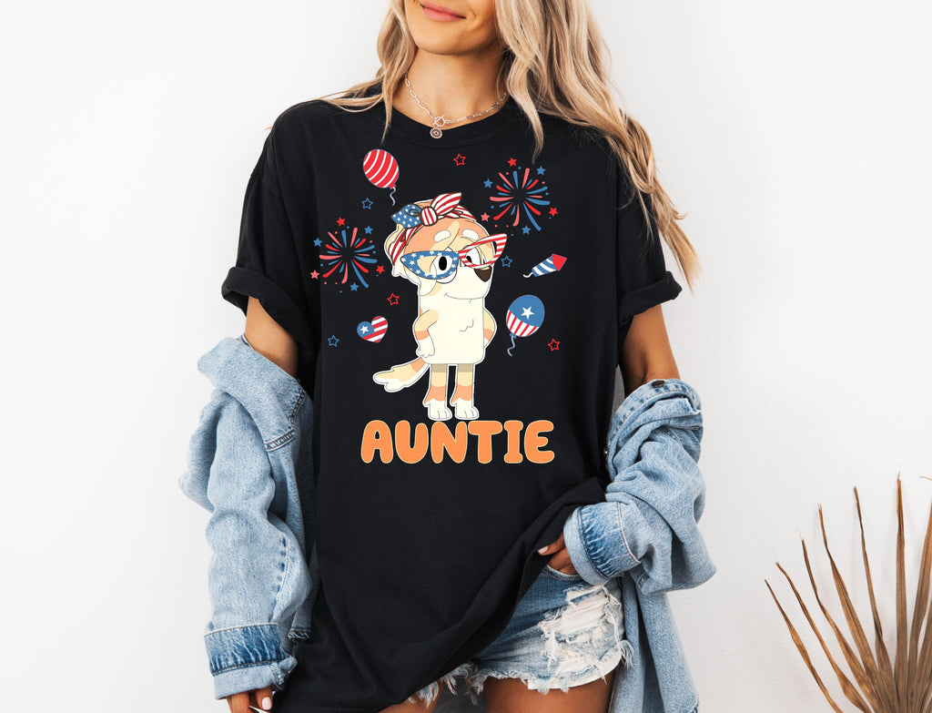 a woman wearing a black shirt with an image of a unicorn on it