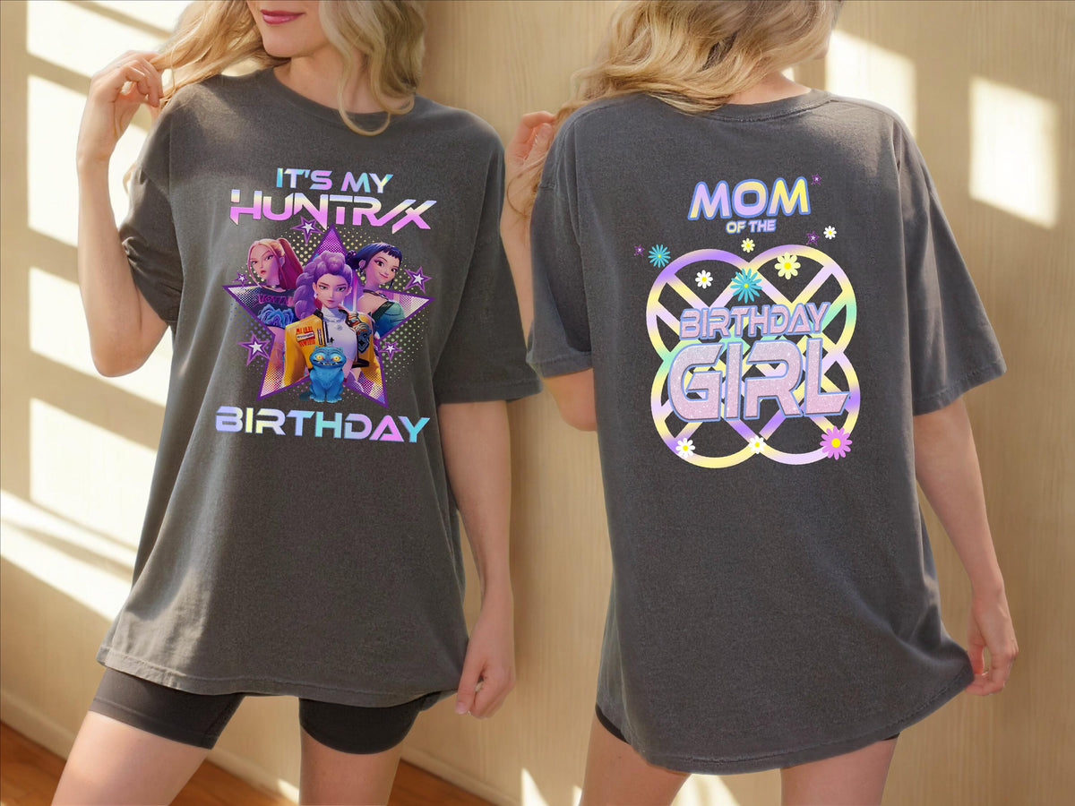 a woman wearing a gray t-shirt with a graphic design on the front and back.