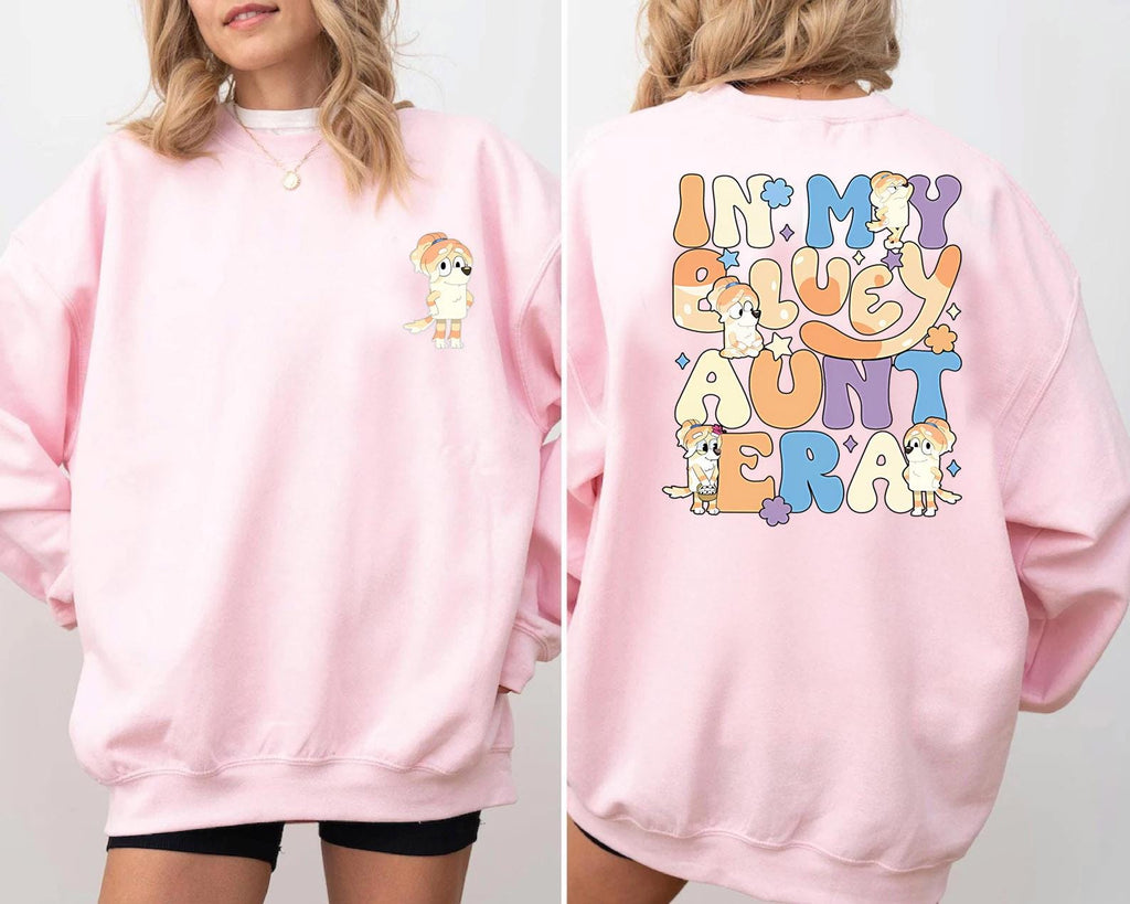 a woman wearing a pink sweatshirt and shorts