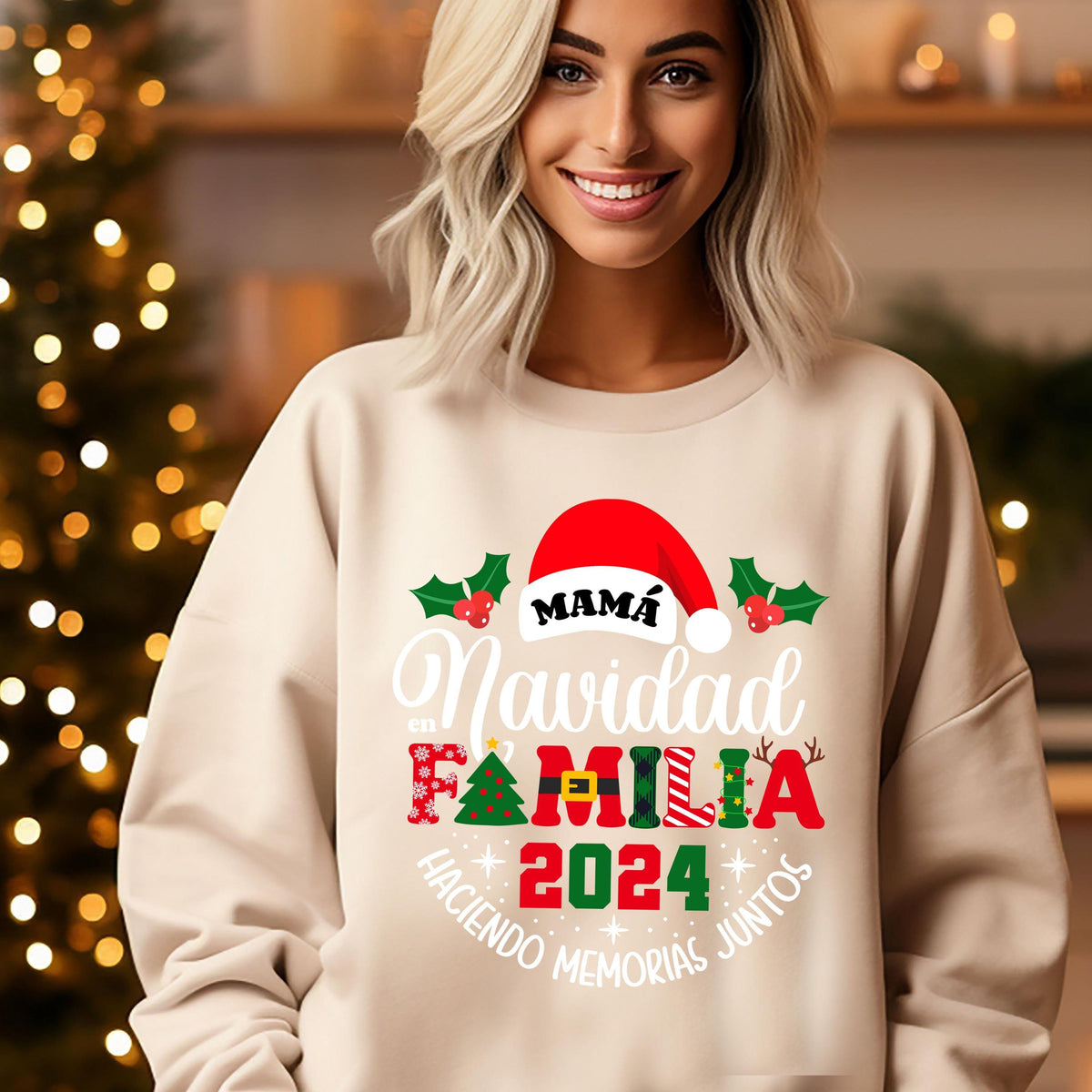 A smiling woman wearing a white sweater with a Christmas-themed design.