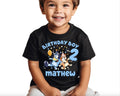 a young boy wearing a birthday boy shirt