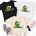 three t-shirts with a Mario character printed on them, along with a pair of black and white checkered shoes and a pair of sunglasses.