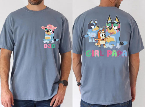 A man wearing a gray t-shirt with a graphic design featuring cartoon characters and the text "DAD" and "GIRL-PAPA" printed on the back.