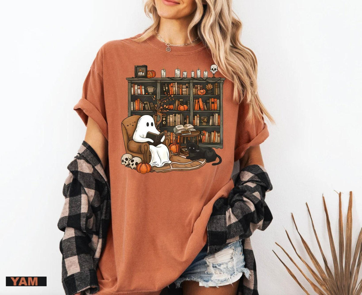 a woman wearing a brown shirt with a dog on it