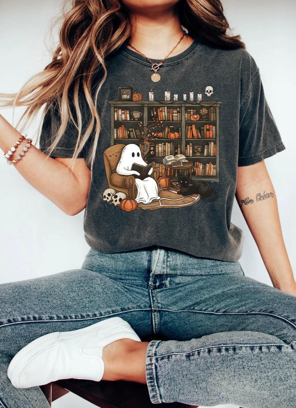 a woman sitting on a chair with a book shelf full of books