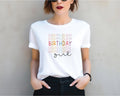 a woman wearing a birthday shirt with the words one written on it