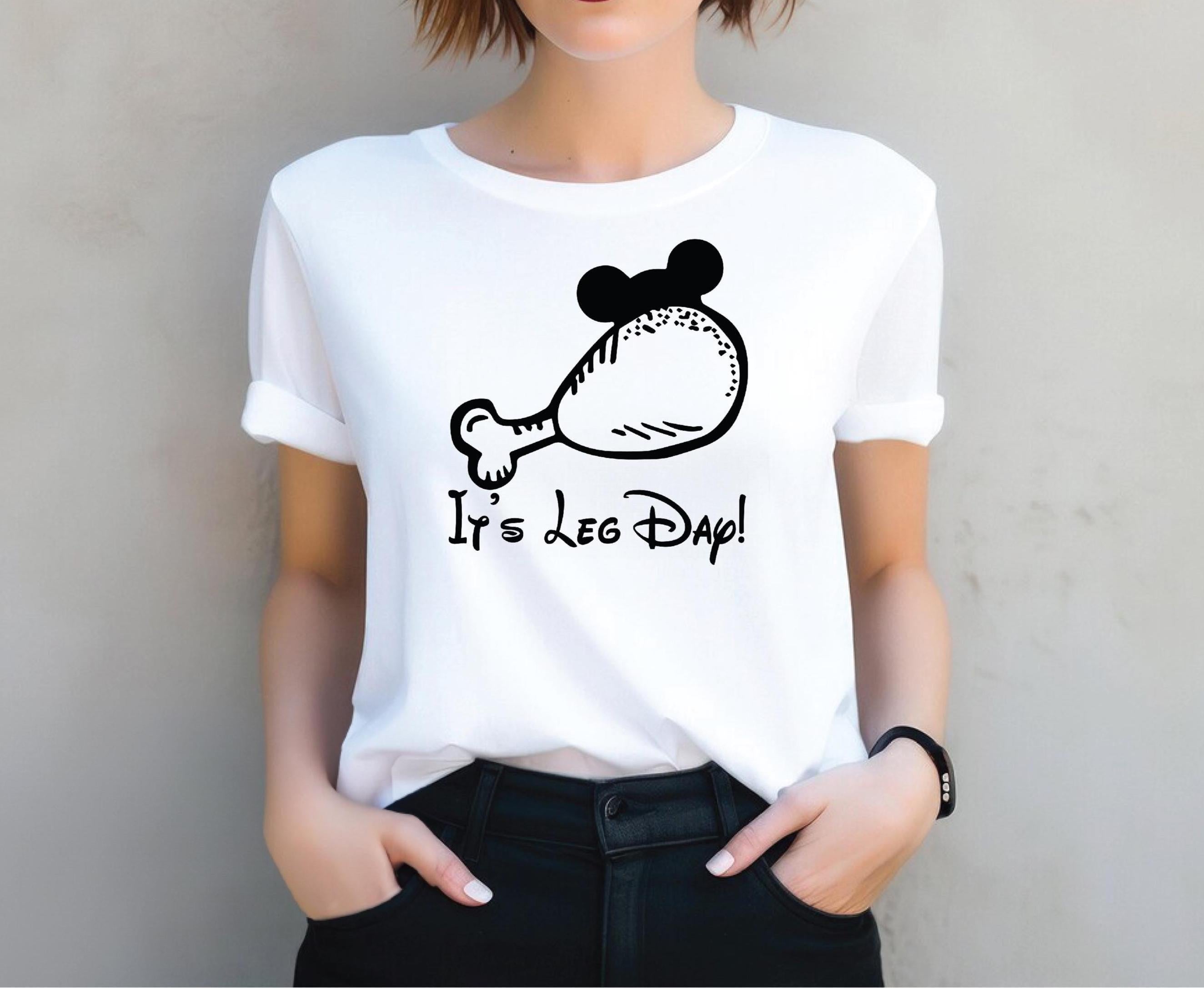 a woman wearing a white shirt with a mickey mouse on it