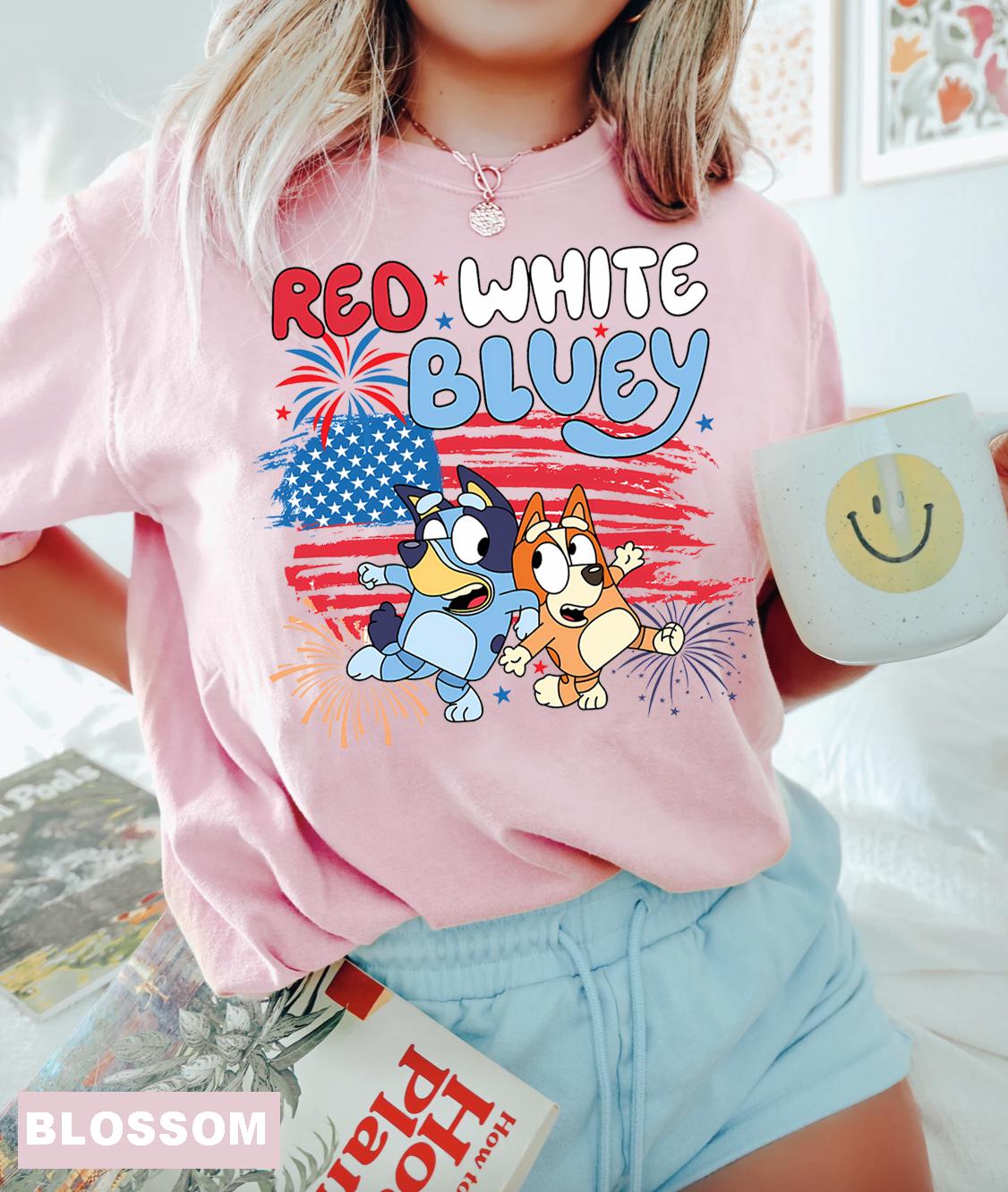 a girl in a pink shirt and blue shorts