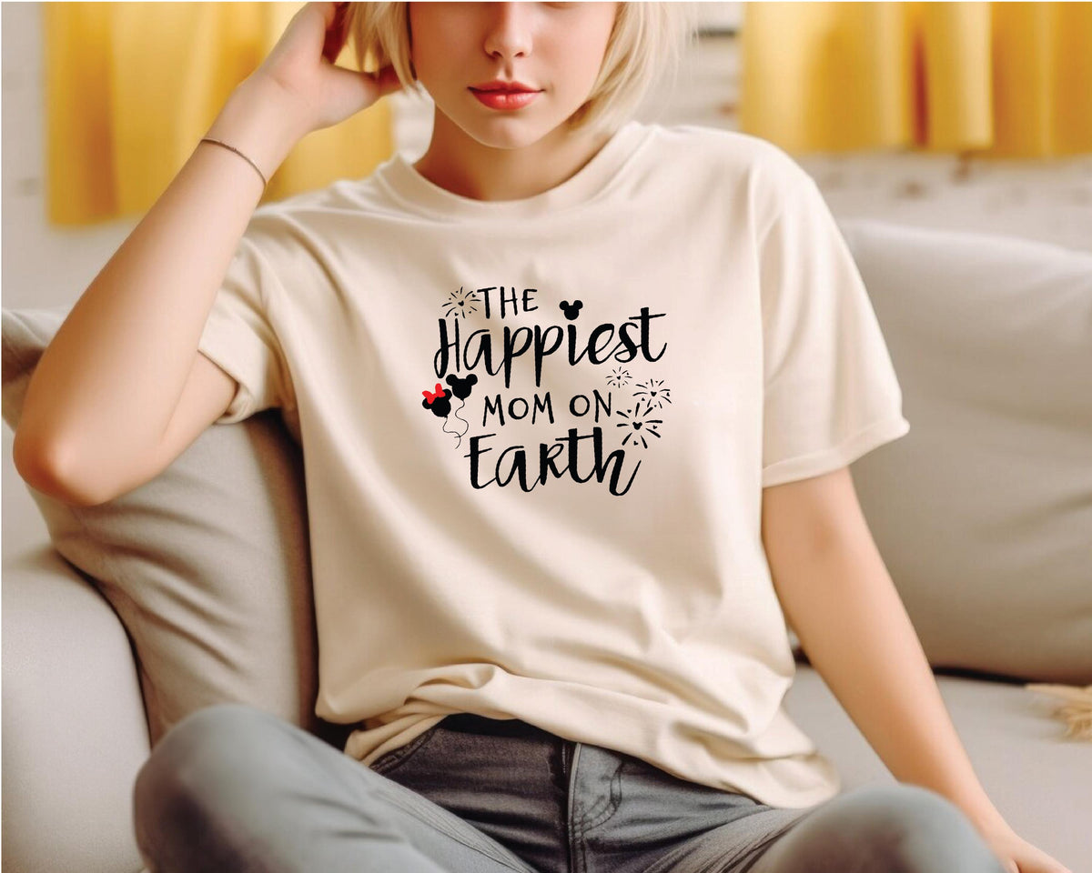 a woman sitting on a couch wearing a t - shirt that says the happ