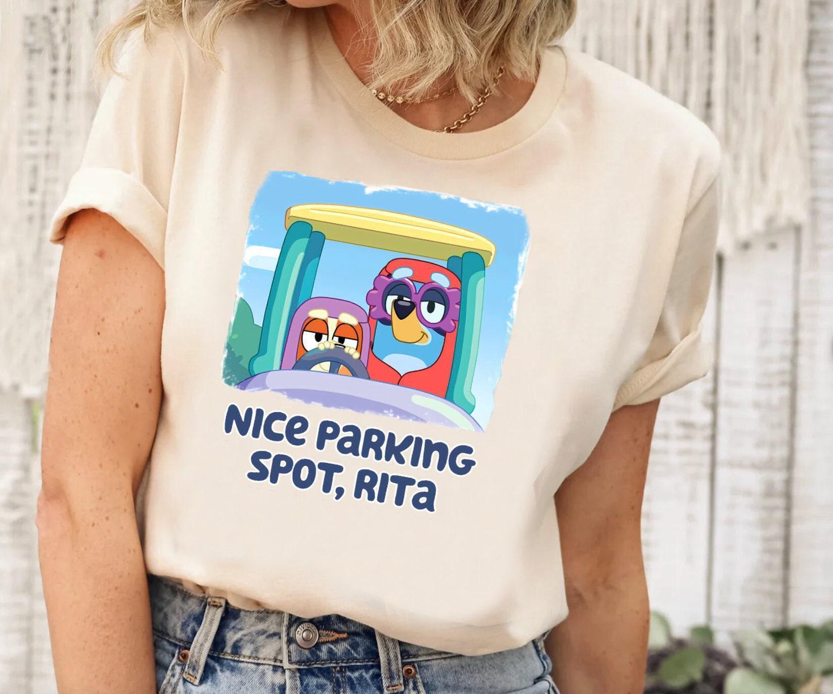 a woman wearing a t - shirt that says nice parking spot, atta