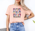a woman wearing a pink t - shirt that says bluey the bead tour