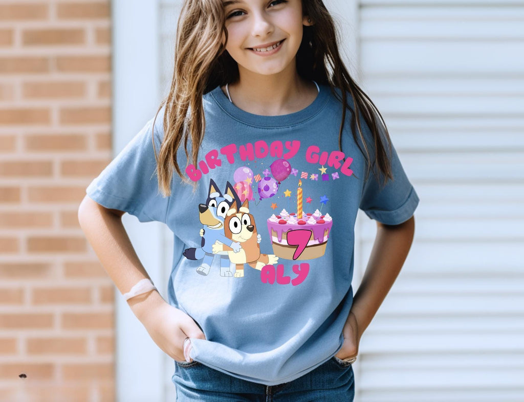 a young girl wearing a birthday girl shirt