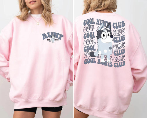 a woman wearing a pink sweatshirt and shorts