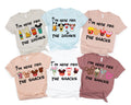 six t-shirts with various Disney-themed graphics and text, including Mickey Mouse and other popular characters, along with phrases like "I'm here for the drinks", "I'm here for the snacks", and "I'm here for the snacks".
