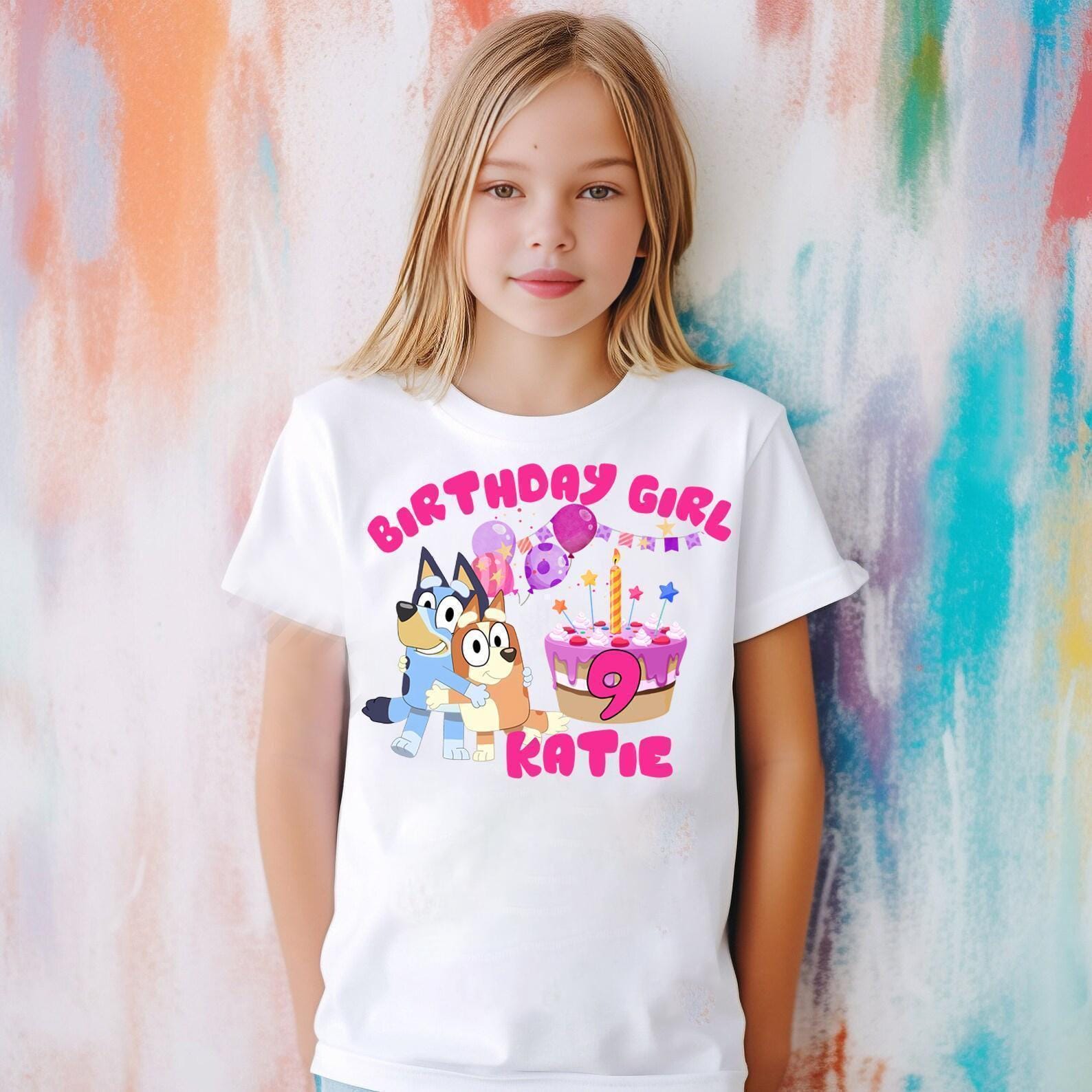 a little girl wearing a birthday girl shirt