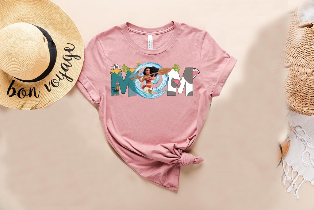 a pink shirt with the word moan on it next to a straw hat