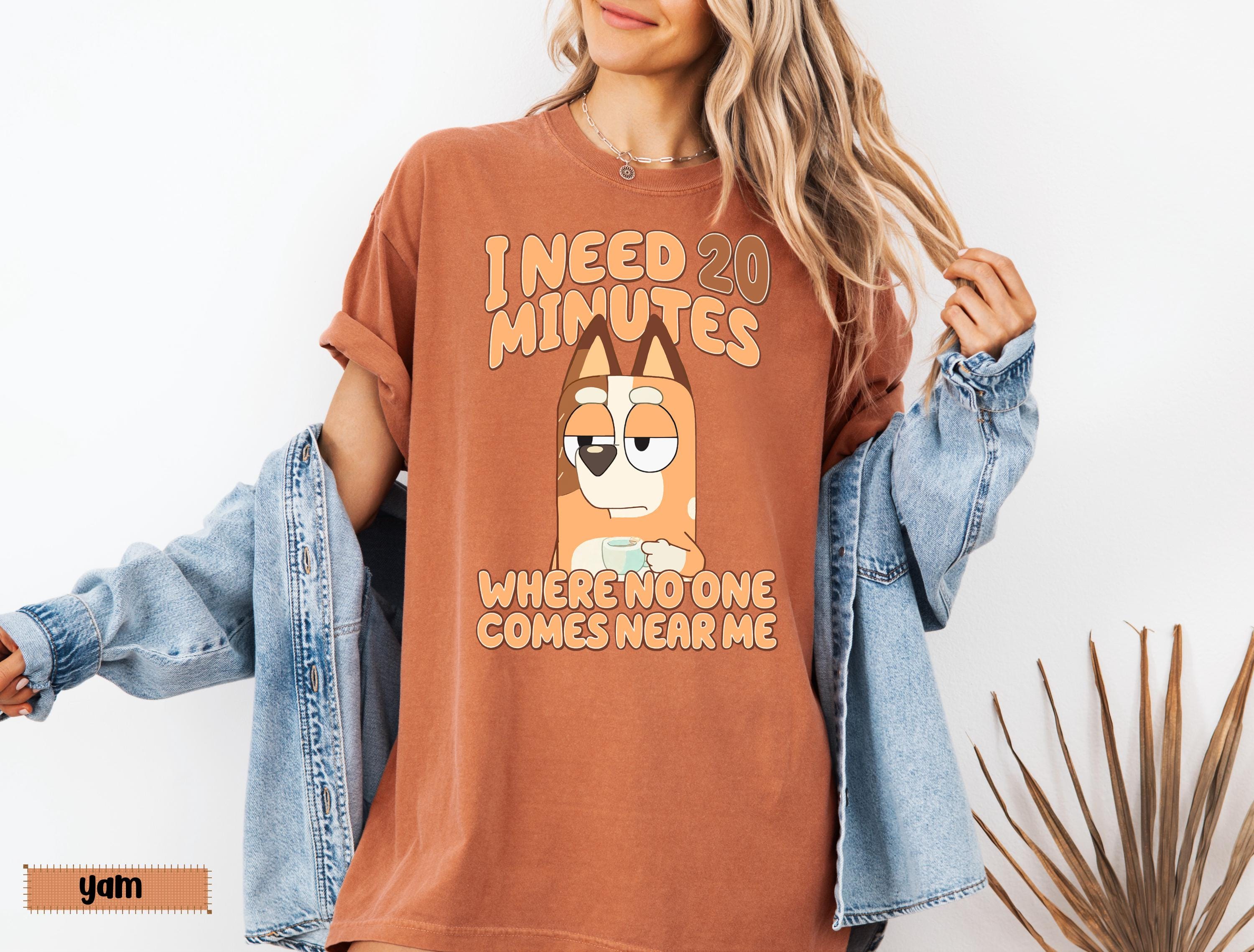 a woman wearing a t - shirt that says i need minutes when someone comes near