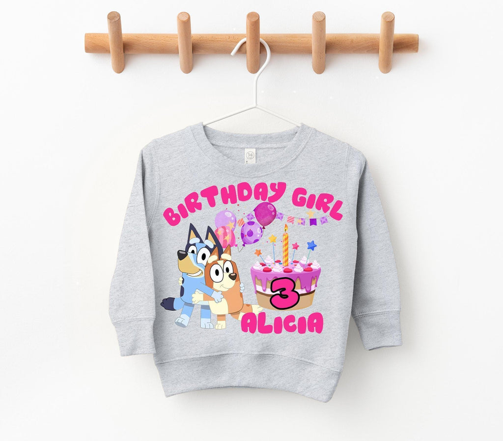 a birthday sweatshirt hanging on a clothes line