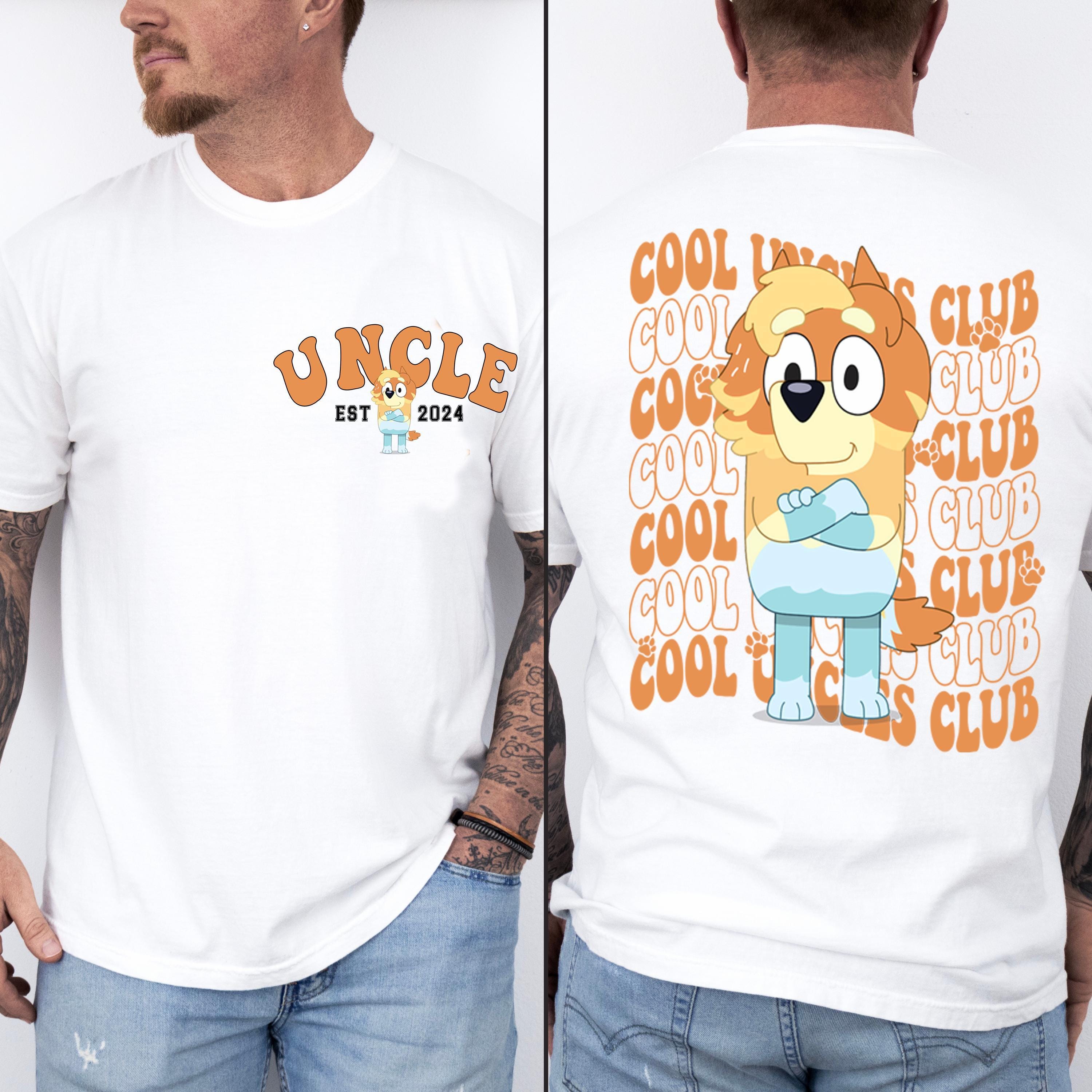 a man wearing a t - shirt with a cartoon character on it