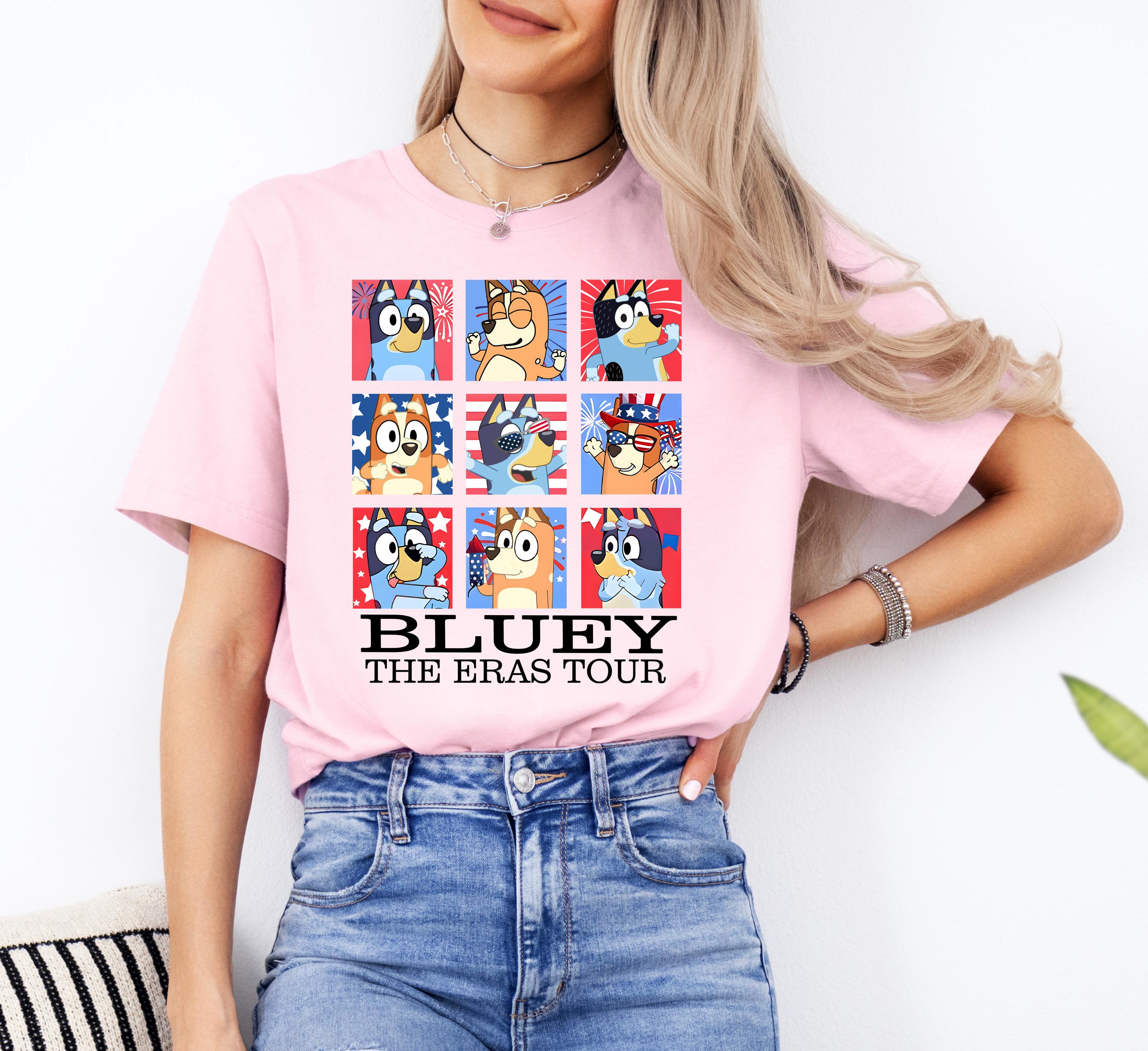 a woman wearing a bluey the eras tour t - shirt