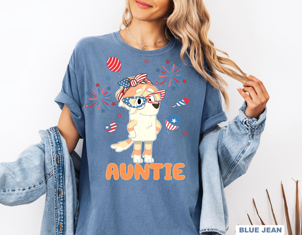 a woman wearing a blue shirt with an image of an animal on it