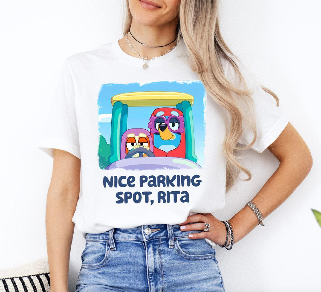 a woman wearing a t - shirt that says nice parking spot, ritta