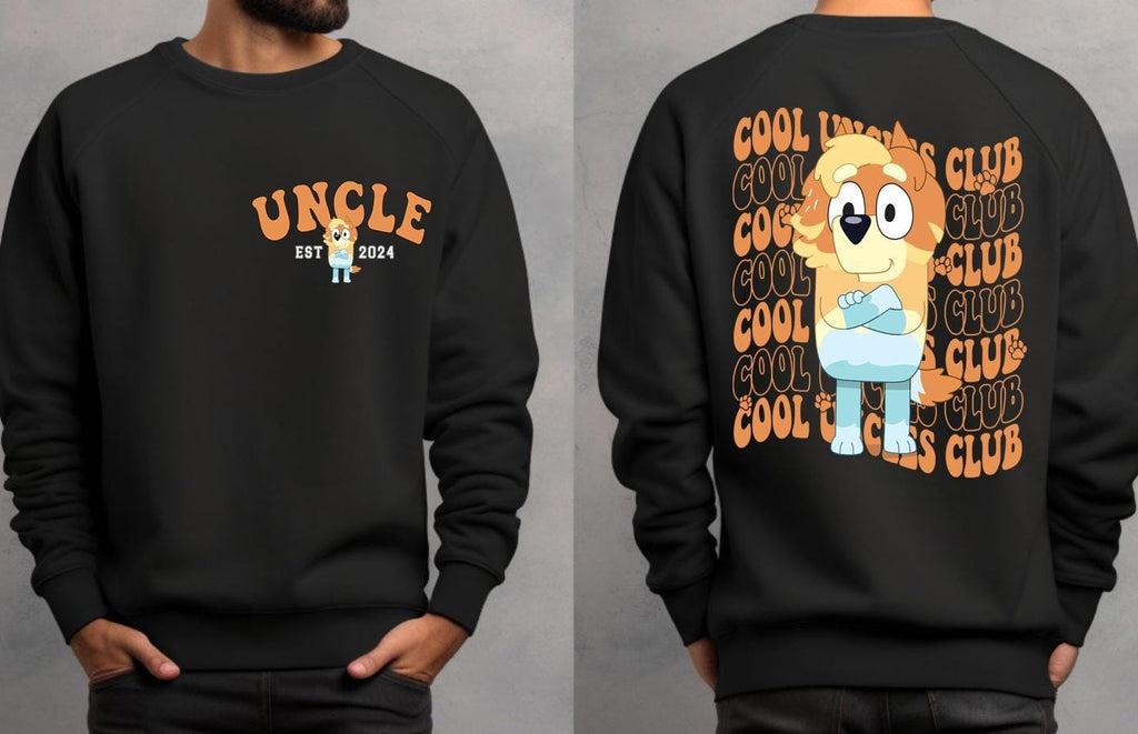 a man wearing a black sweatshirt with a cartoon character on it