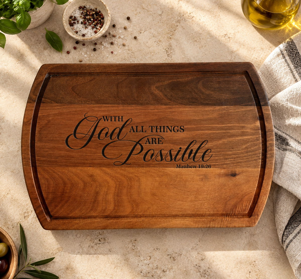 a wooden cutting board with a quote about God's all things being possible, along with some spices and a glass of olive oil.