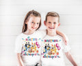 a couple of kids standing next to each other