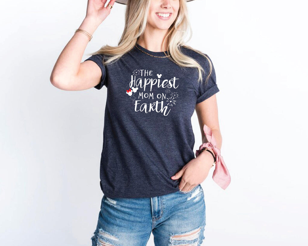 a woman wearing a hat and a t - shirt that says the happest