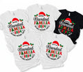a collection of five white t-shirts with festive holiday-themed designs, including text and graphics related to the Christmas holiday.