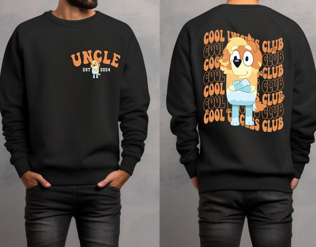a man wearing a black sweatshirt with a cartoon character on it