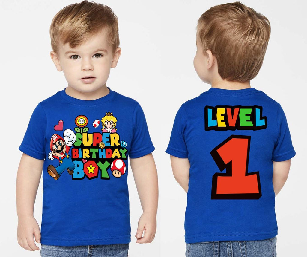 a young boy wearing a blue shirt with the number one on it