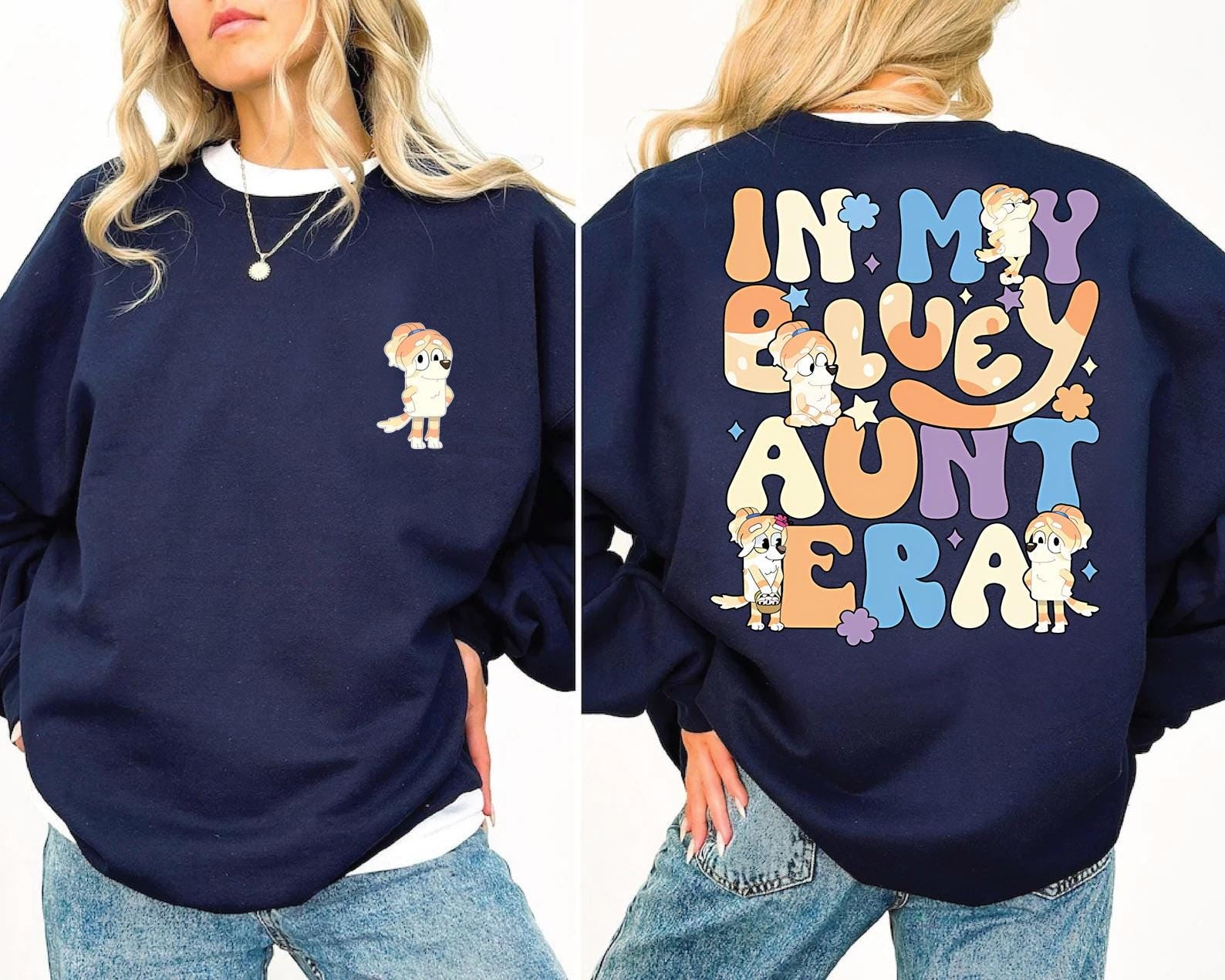 a woman wearing a blue sweatshirt with cartoon characters on it