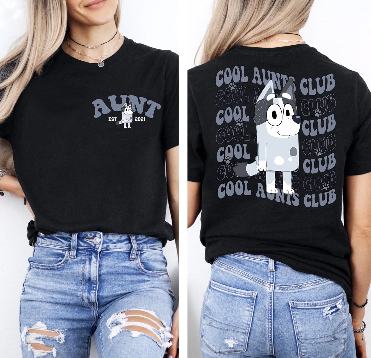 a woman wearing a black shirt and ripped jeans