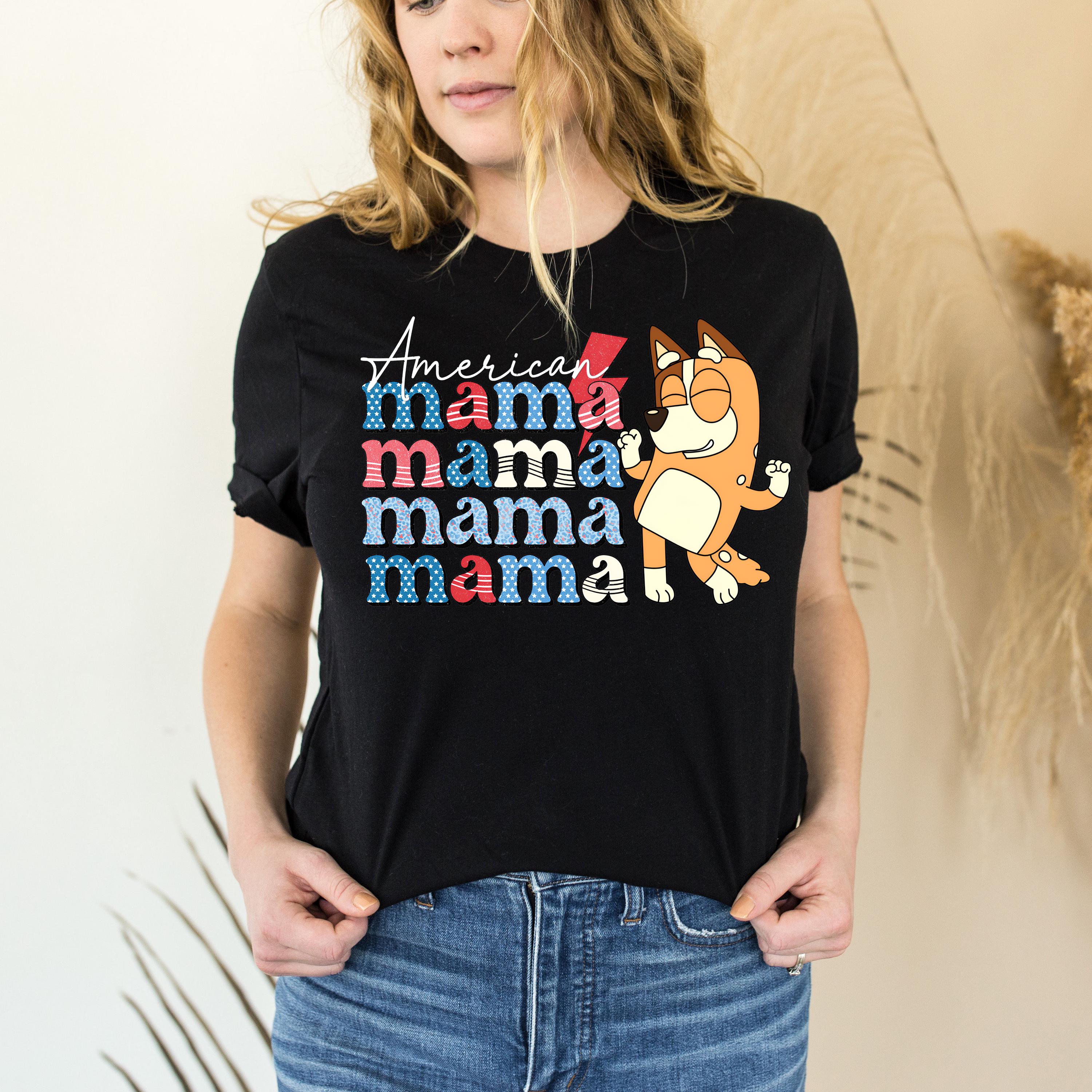 a woman wearing a black mama mama shirt