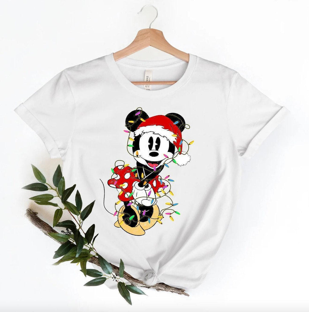 a white shirt with a mickey mouse on it