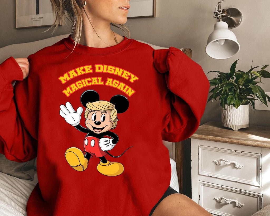 a woman wearing a red sweatshirt with mickey mouse on it