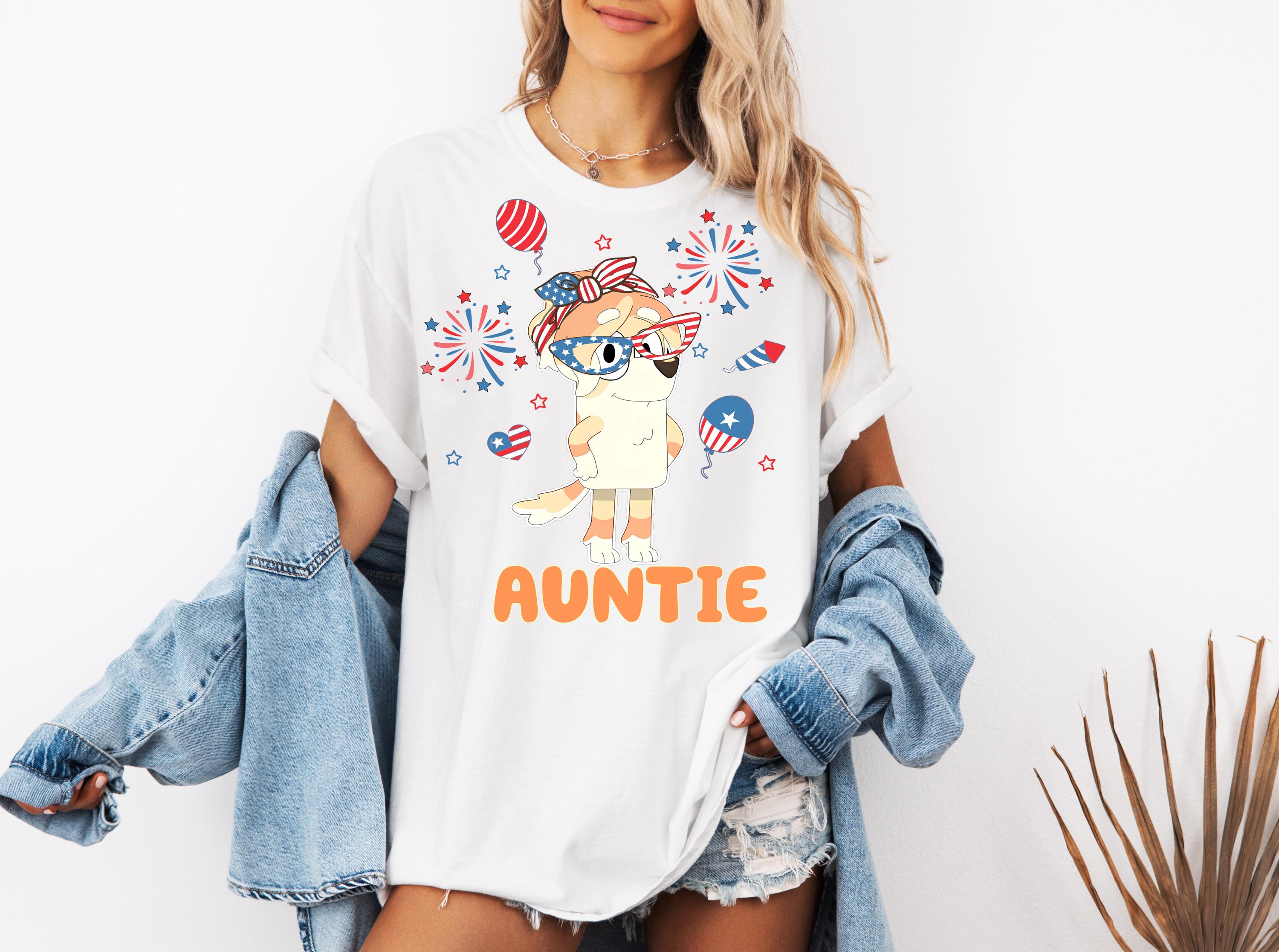 a woman wearing a white shirt with an image of an animal on it