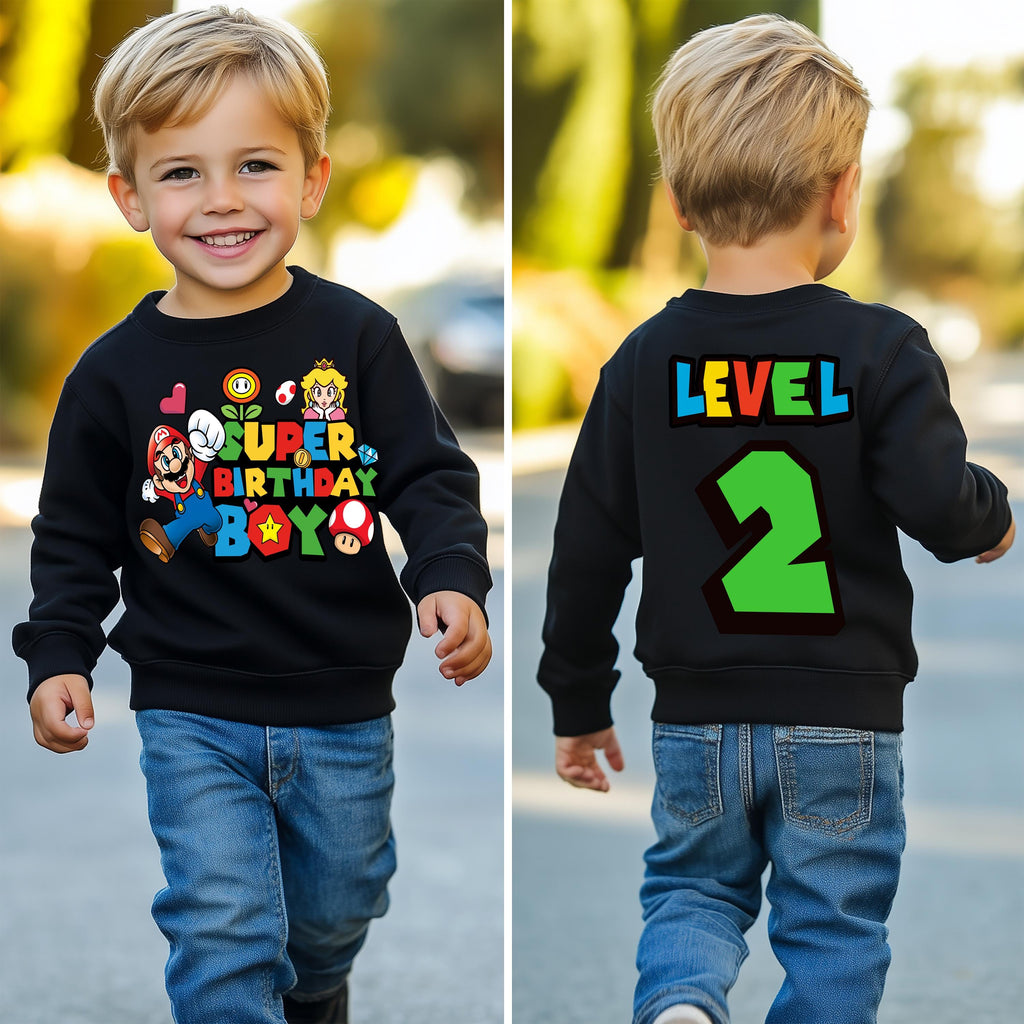 a young boy wearing a black sweatshirt with the number 2 on it