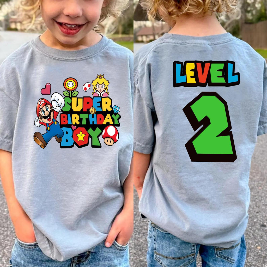 two young children wearing matching birthday shirts