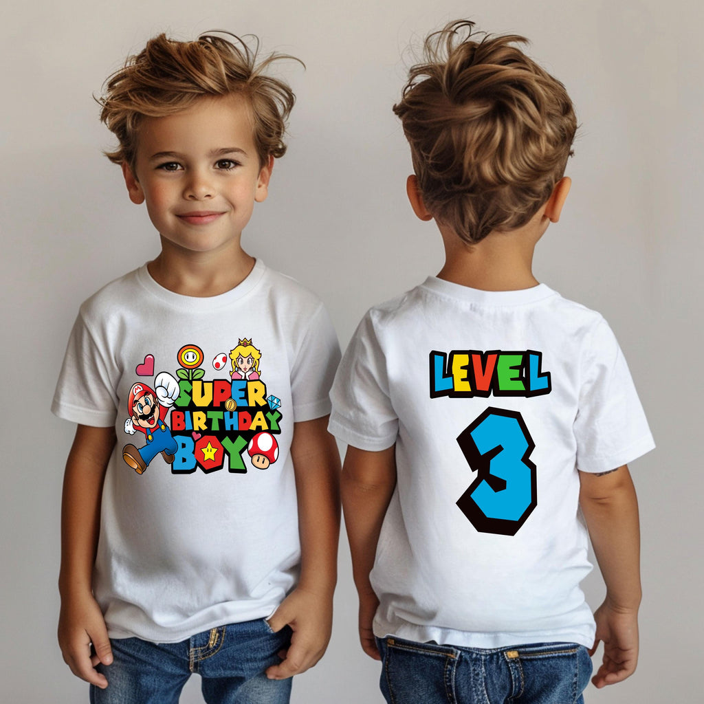 two young boys wearing matching birthday shirts