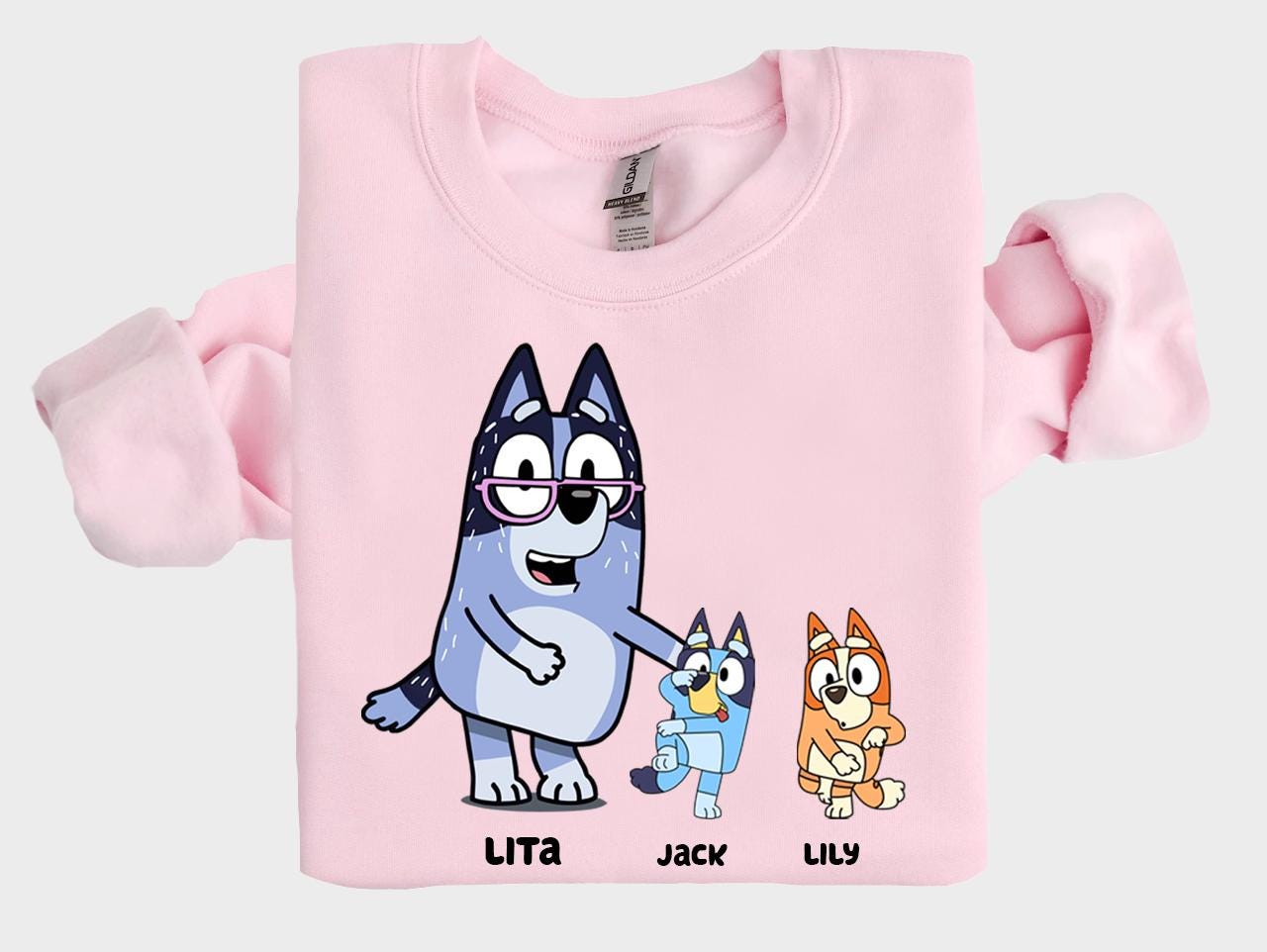 a pink shirt with cartoon characters on it