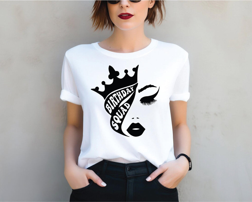 a woman wearing a t - shirt with a crown on it