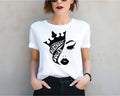a woman wearing a t - shirt with a crown on it