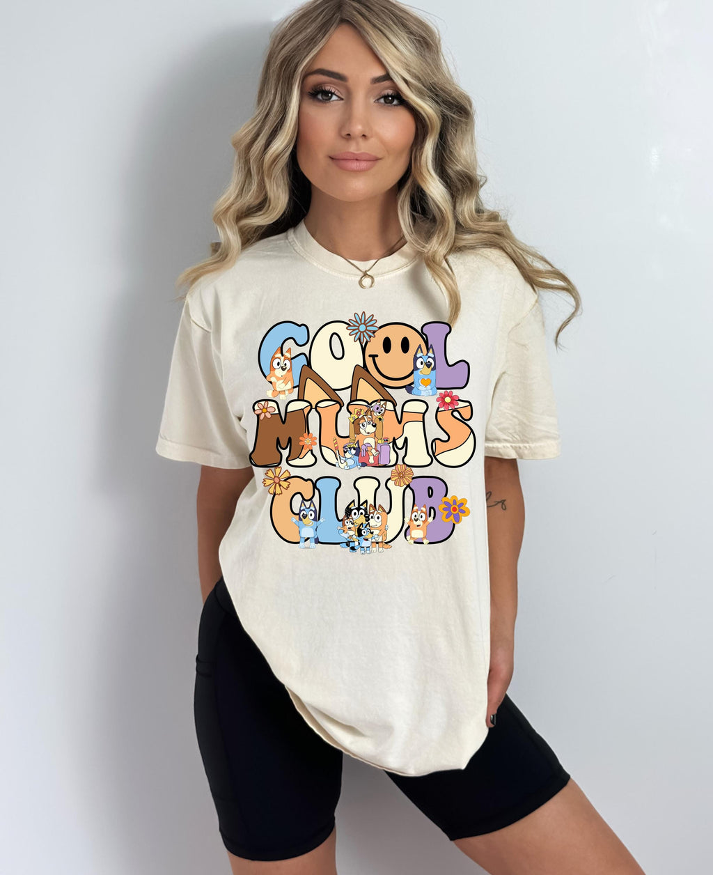 a woman wearing a white shirt with the words good times club on it