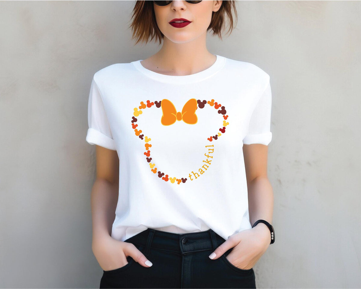 a woman wearing a mickey mouse t - shirt