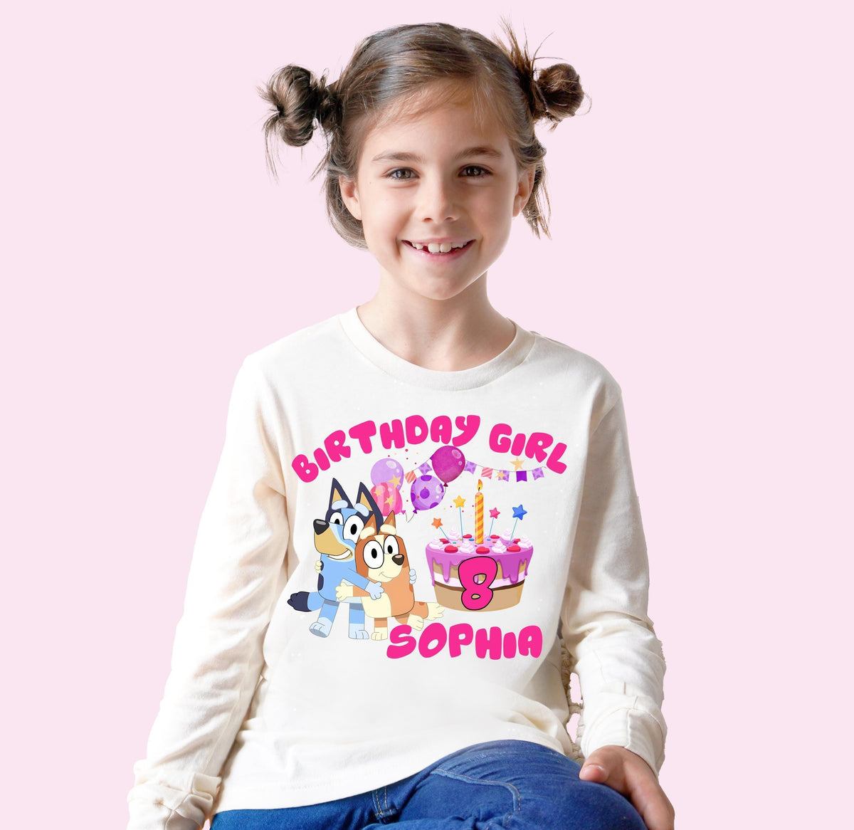 a young girl sitting on a stool wearing a birthday girl shirt