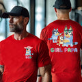 A man wearing a red t-shirt with a cartoon character and the text "GIRL PAPA" printed on it.