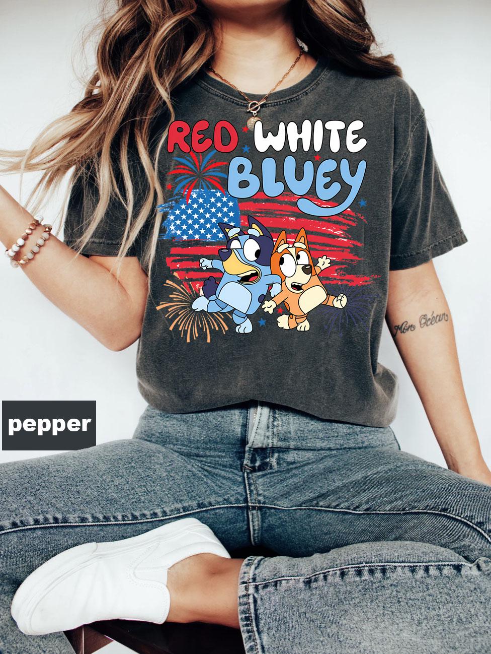 a woman wearing a red white and blue shirt